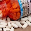 Buy ketamine pills for sale online Australia for fast relief, showing white caplets beside an orange bottle. Buy white ketamine pills for sale online Australia for targeted pain management, spilling from an open bottle. Buy oral ketamine pills for sale online Australia for improved wellness, shown as white tablets by a bottle.
